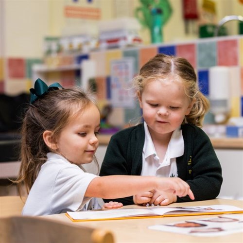 Pre-School pupils reading together